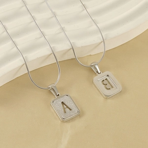 Polished silver stainless steel snake chain necklace with hollow letter A and B pendants