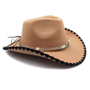 Detail of camel wool fedora with black woven edge and ethnic beaded leather band