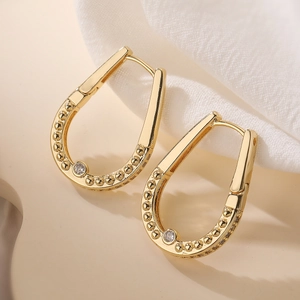 Minimalist gold plated U-shaped earrings with bead texture and sparkling round zircon stone