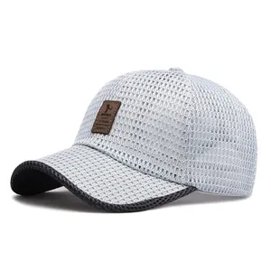 Light blue mesh baseball cap with brown leather label and dark grey brim detail