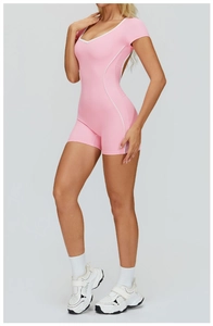 Pink athletic bodysuit with white piping and deep V-neckline for fitness and yoga