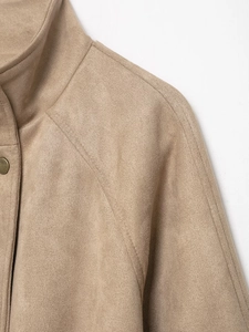 Close-up of precise stitching on khaki faux suede jacket collar and shoulder seams