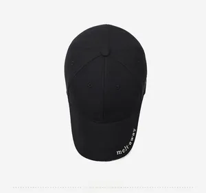 Close-up of black baseball cap with white melt away embroidery on the brim edge