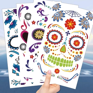 Detail of Day of the Dead temporary tattoos with colorful sugar skulls and flower patterns