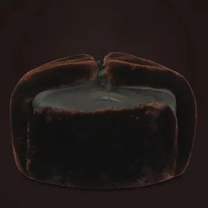 Detail view of thickened thermal lining and faux fur on deep brown winter trapper hat