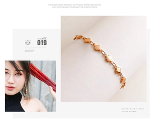 Detail of rose gold double heart link bracelet with polished surface for daily wear