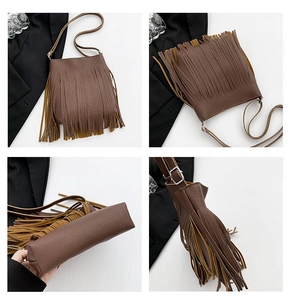 Detail view of brown leather bucket bag showing tassel layers and adjustable strap