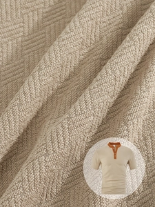 Close-up of khaki waffle knit fabric texture on men's short sleeve casual polo shirt