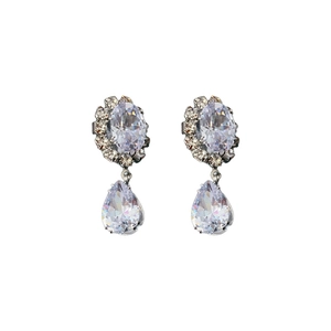 Elegant silver teardrop zircon earrings set with sparkling stones for evening wear
