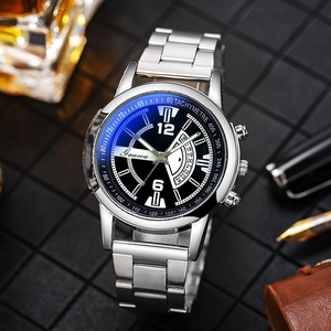 Detailed close-up of a silver stainless steel watch with a black dial and date window