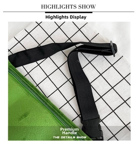 Detail of green plush bag showing adjustable black strap with durable plastic buckle