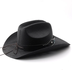 Detail of black straw cowboy hat featuring studded leather band and blue gemstones