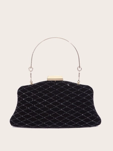 Detail of black velvet evening clutch featuring diamond quilted beads and gold metal handle