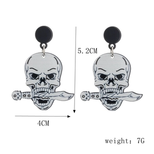 Detail view of glitter skull earring with dimensions 5.2cm by 4cm and 7g weight