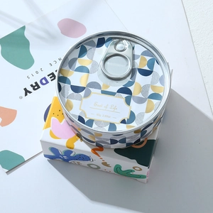 Top view of 80g tin aromatherapy soy candle with blue and gold geometric design
