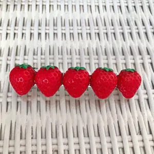 Handmade strawberry hair clip with five red simulation fruits and green leaves