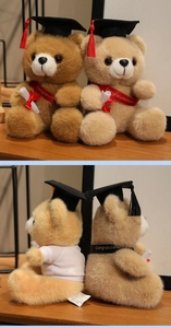 Detail of graduation teddy bear with black mortarboard and Congratulations sash decoration