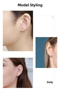 Vue macro de boucles d'oreilles en argent et zircon avec serti à griffes sur modèle