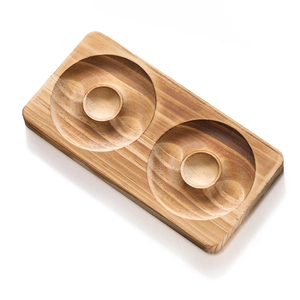 Detail of wooden jewelry design board with double circular grooves and natural wood grain texture