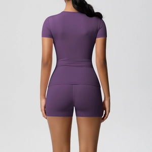 Rear view of deep purple compression yoga set with short sleeve t-shirt and gym shorts