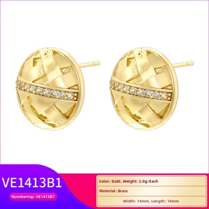 Front view of gold brass disc earrings with woven texture and white cubic zirconia accents