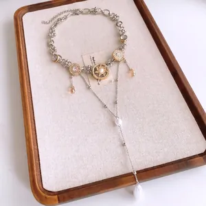 Vintage Halskette in Gold und Silber mit Perlen und langen Quasten-Anhängern