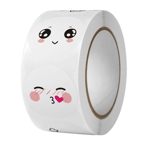 Detail showing a roll of 500 cute cartoon smiley face reward stickers for kids