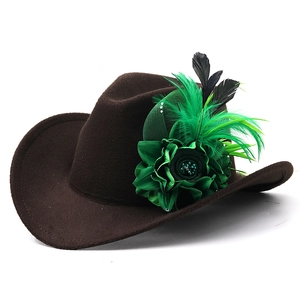 Detail of dark brown felt fedora featuring elegant green silk flower and feather accents