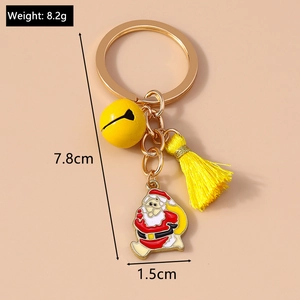 Detailed view of Christmas keychain with yellow tassel, bell, and Santa pendant with dimensions