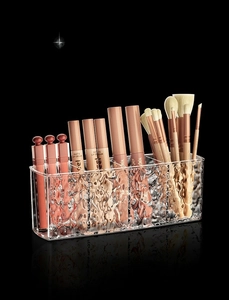 Macro shot of 5-compartment acrylic makeup brush holder with elegant water ripple texture