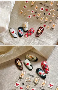 Detail view of vintage rabbit nail art stickers with poker and tea cup patterns
