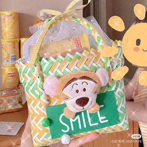 Detail view of woven gift basket with Tigger plush decor and plaid ribbon handle