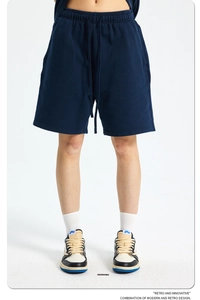 Detail of navy blue washed cotton shorts featuring an elastic drawstring waistband