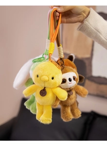 Detailed plush animal keychain set featuring yellow chick, brown sloth, and green rabbit
