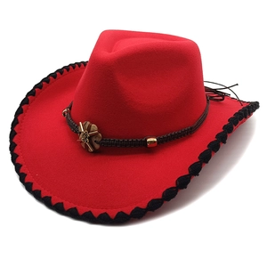 Red wool western cowboy hat with black braided brim and bronze floral metal buckle
