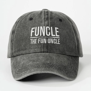 Detail of white FUNCLE embroidery on a dark gray washed vintage cotton baseball cap