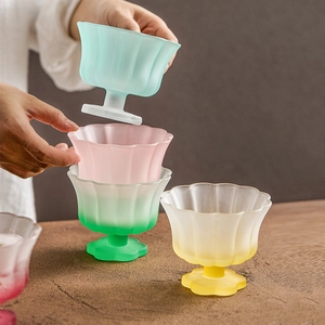Frosted glass petal-shaped dessert bowls in pastel yellow, green, pink and blue colors