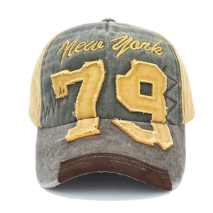 Detail of vintage baseball cap featuring 79 patch and New York embroidery on washed cotton