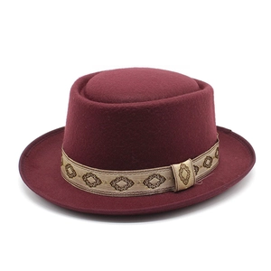 Classic burgundy wool pork pie hat with a decorative bohemian embroidered ribbon band