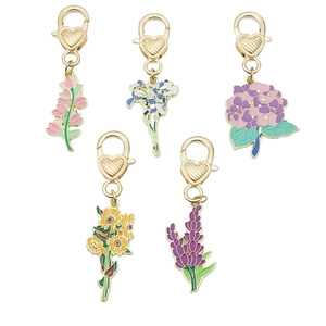 Five-piece set of floral enamel keychains with pink and purple flowers on gold heart clips