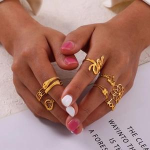 Bohemian gold stainless steel ring set featuring snake, crown, and floral designs