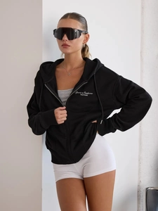 Women's black oversized zip-up hoodie with white letter print for street style fashion