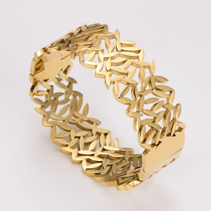 Minimalist gold leaf cutout cuff bracelet in stainless steel on white background