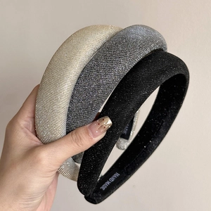 Elegant glittering headband set in champagne, silver, and black with handmade label