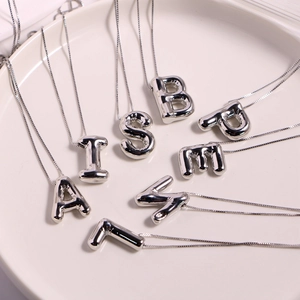 Polished silver puff letter pendant necklace set featuring 3D balloon style alphabet