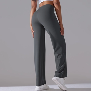 Rear view of high waisted wide leg dark gray yoga pants showing slim lift silhouette