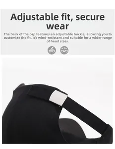 Detail of adjustable metal buckle and cotton twill strap on black baseball cap