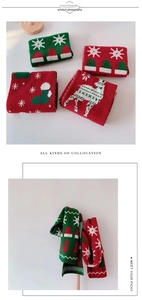 Detail of Christmas knitted scarf featuring red and green reindeer and snowflake patterns