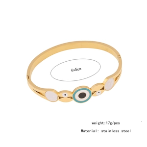 Detailed top view of gold stainless steel evil eye open bangle showing 6x5cm dimensions