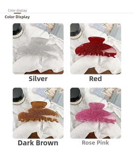 Detail view of large glitter acrylic hair claws in silver, red, brown and rose colors